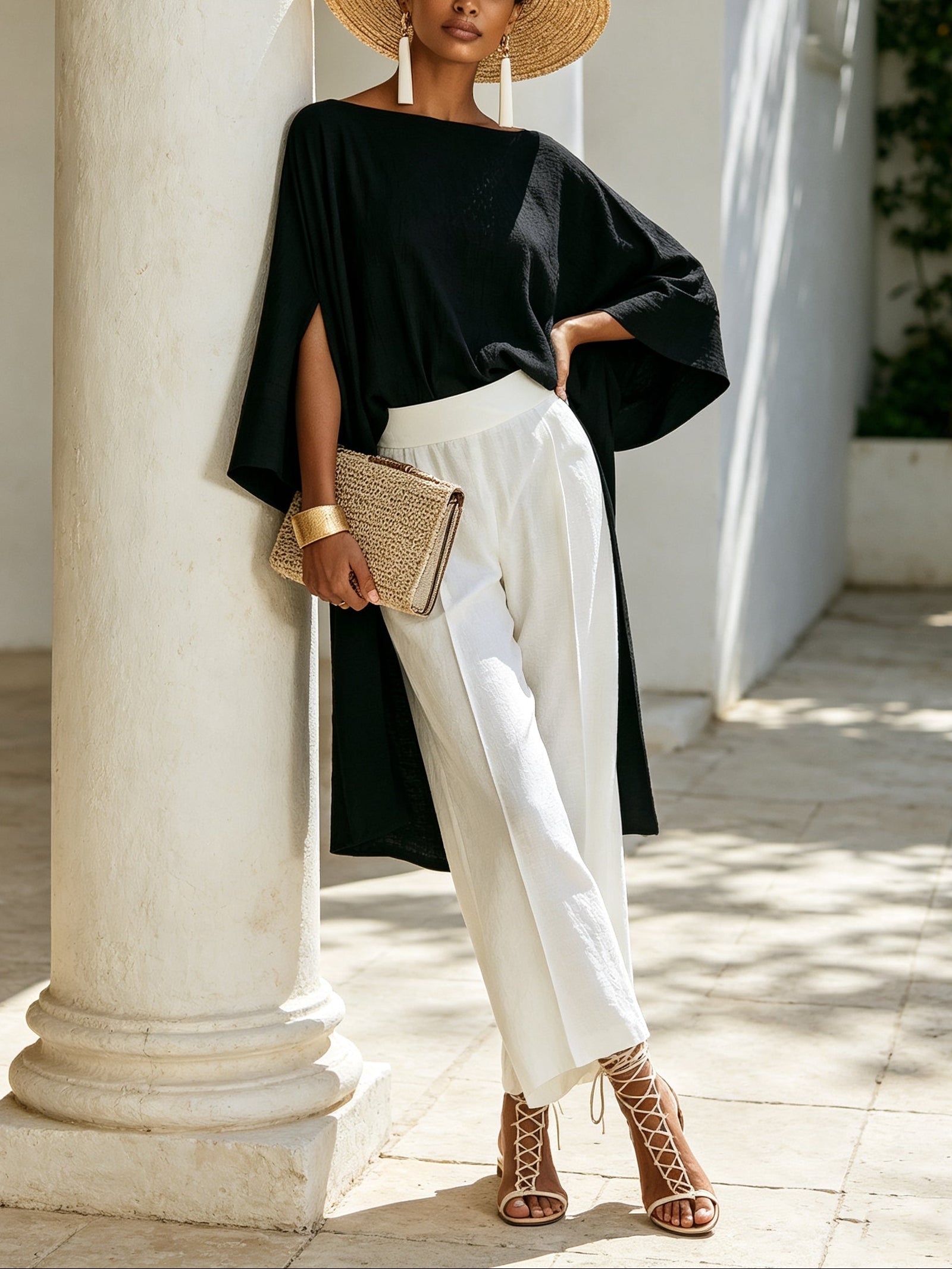 Elegant black asymmetrical top and white wide-leg pants set