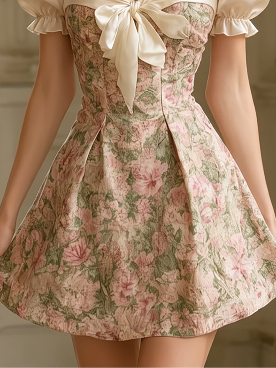 Palace-style printed puff-sleeve dress with a bow